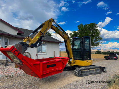 A Bear Iron Works 1 Cubic Yard Bedding Box being utilized with a mini excavator