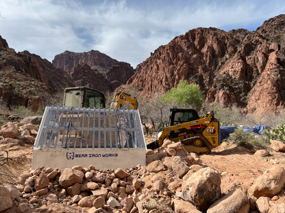 a construction site in the grand canyon using a grizzly rock screen to sort material.