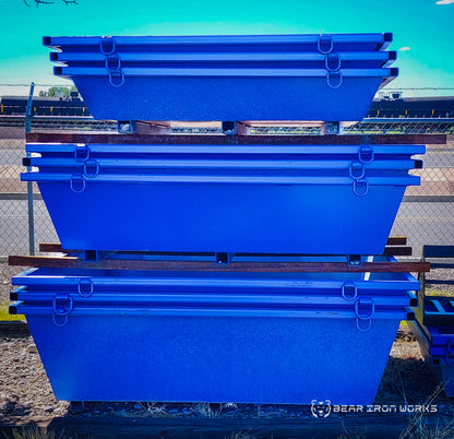 Concrete washout tubs nested together and stacked on-top of one another.