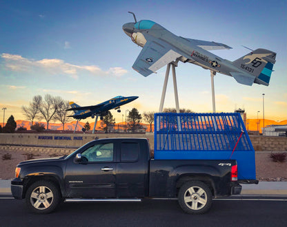 a small grizzly rock screen in a pickup truck bed.