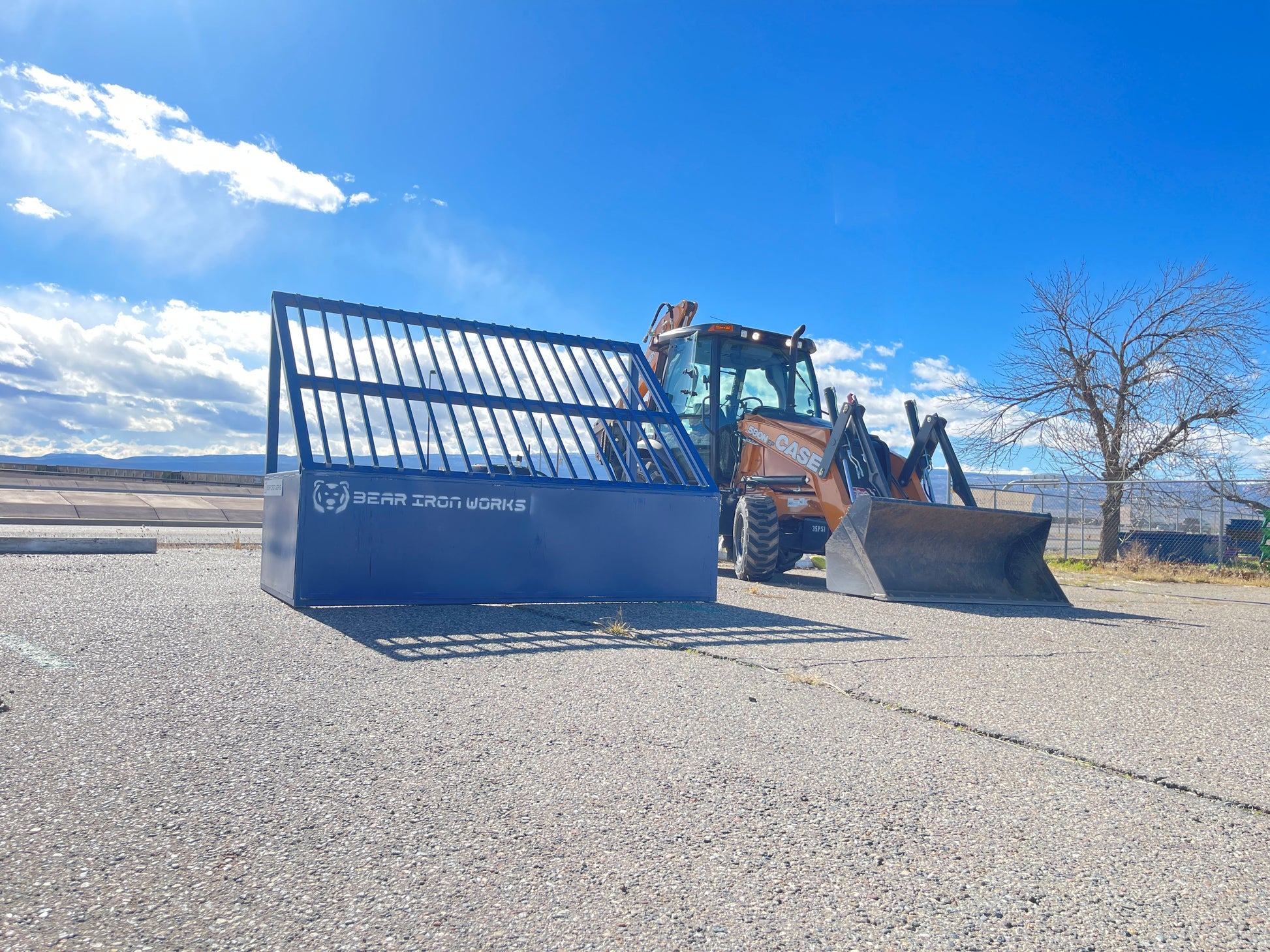 a grizzly rock screen in front of a backhoe