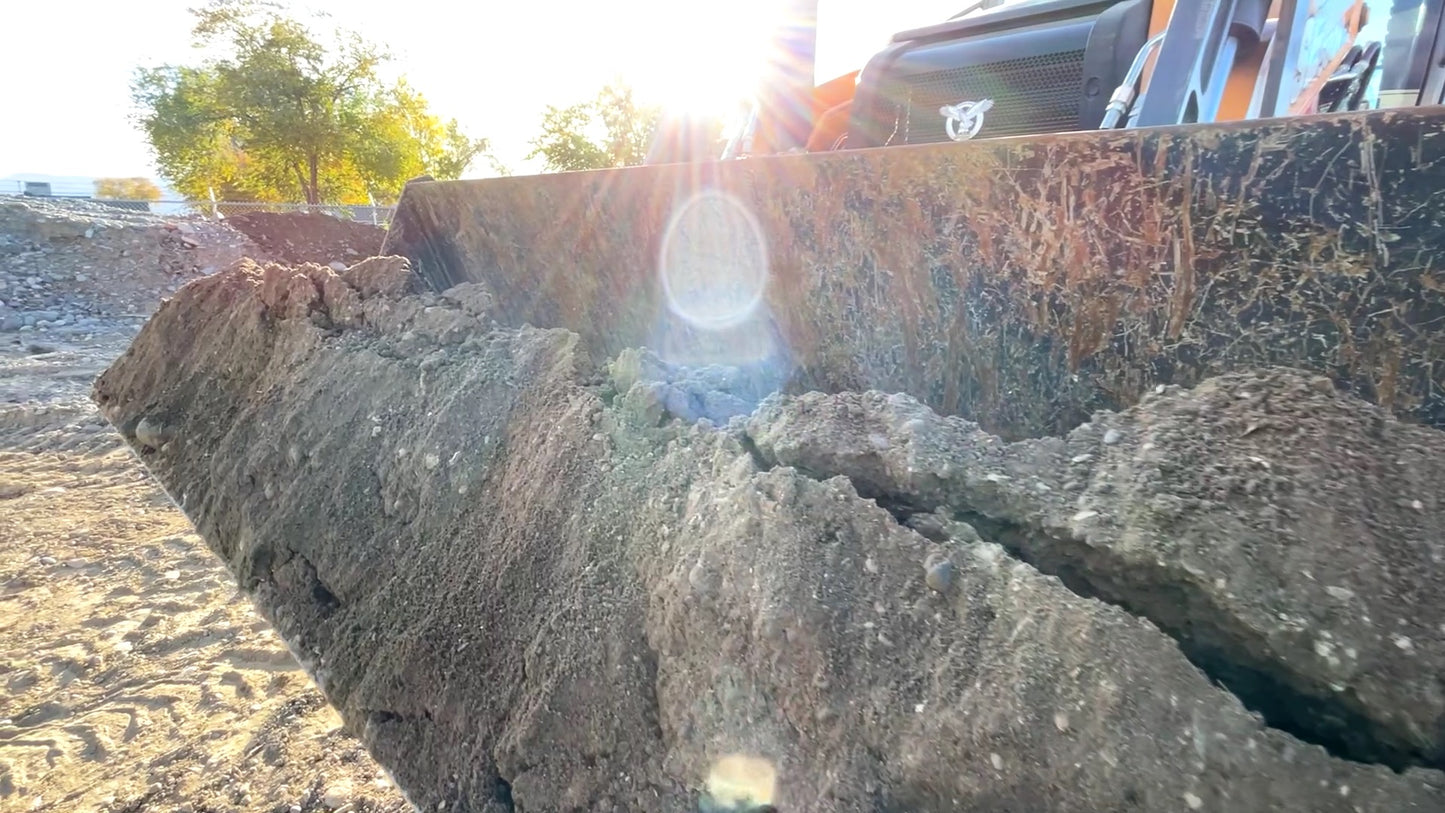 Screened material made from a grizzly rock screen.