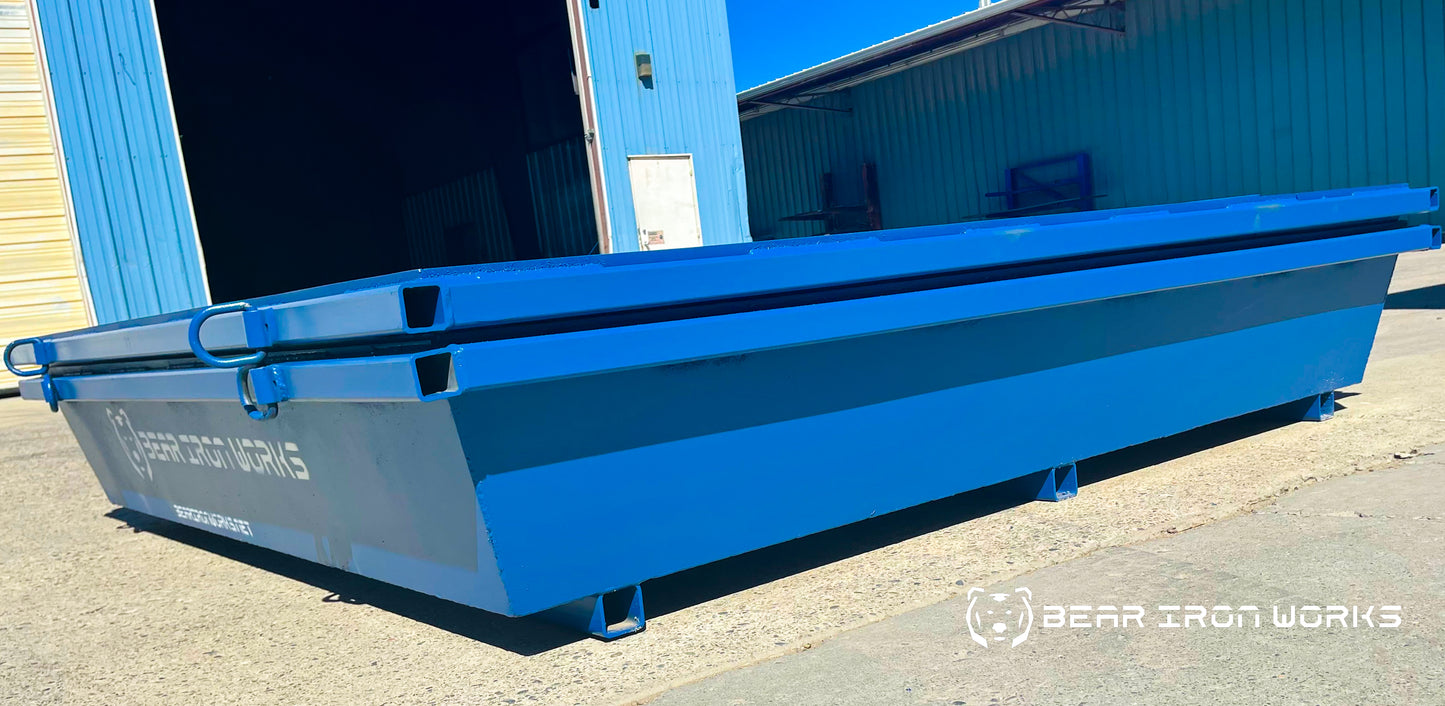 Two blue concrete washout tubs made by bear iron works stacked together.